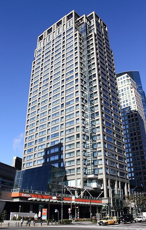 The Nisseki Yokohama Building, a tall office tower against a blue sky